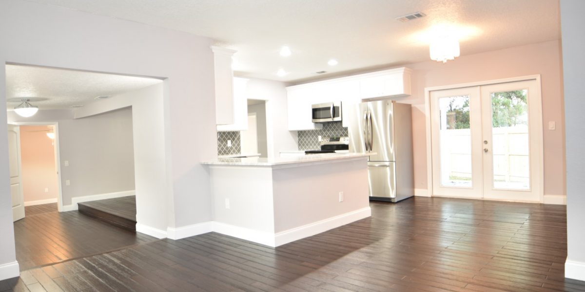 Open Concept Kitchen with Super Glossy Cabinets and Gleaming Hardwood Floors
